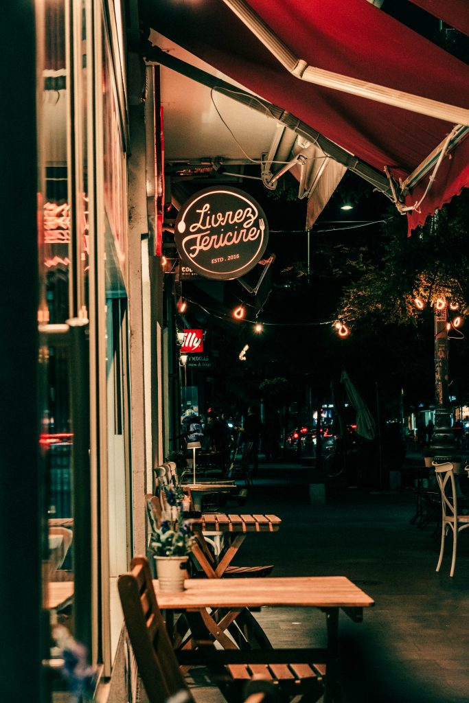 Street at Night in Romania with Restaurant Tables