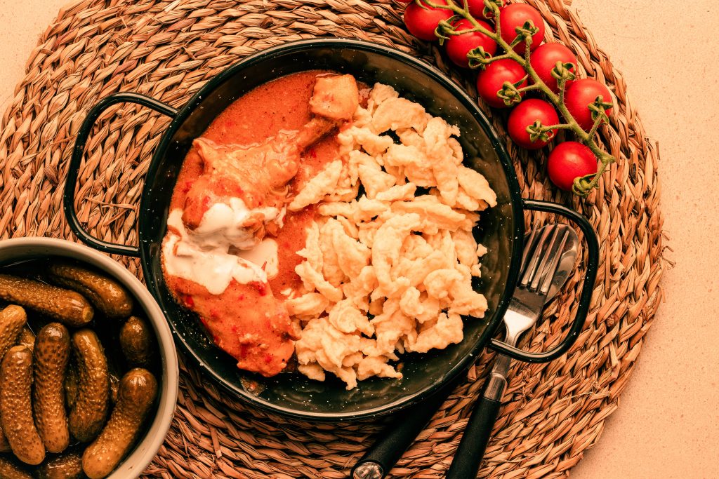 Weekend in Budapest - Itinerary and Guide Traditional Hungarian paprikash served in a cast-iron dish