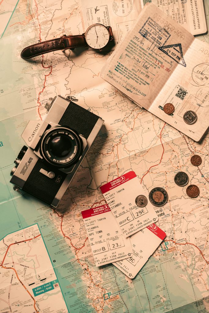Photo of Map with Coins and Camera