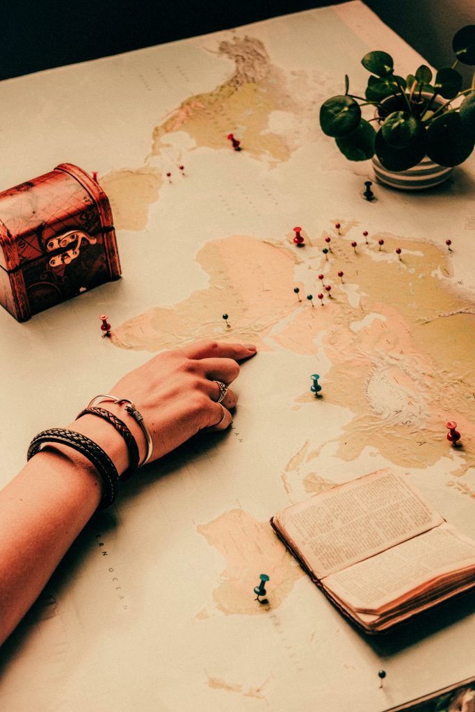 Hand Point on a World Map