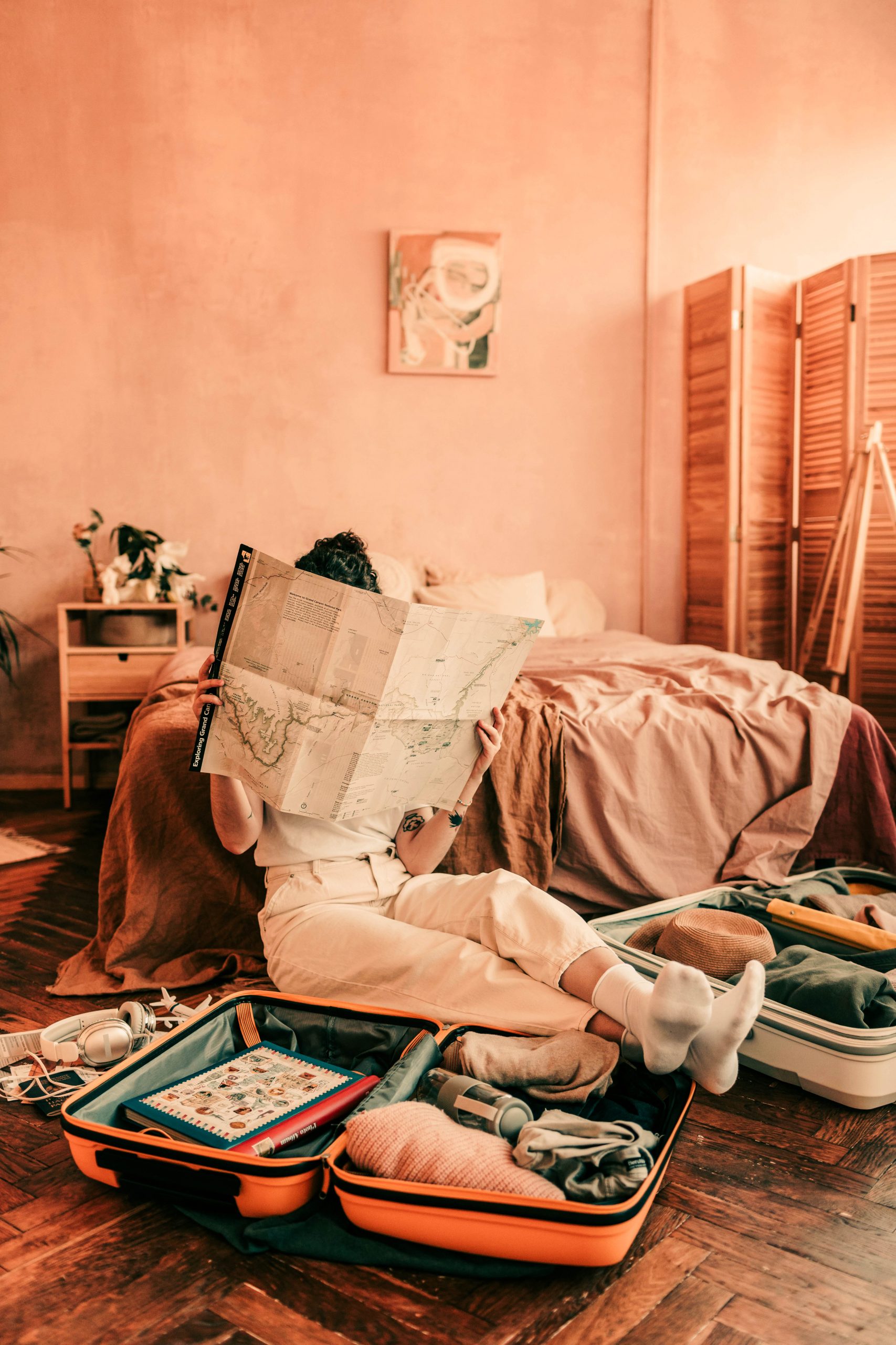 Woman with Map and Suitcases