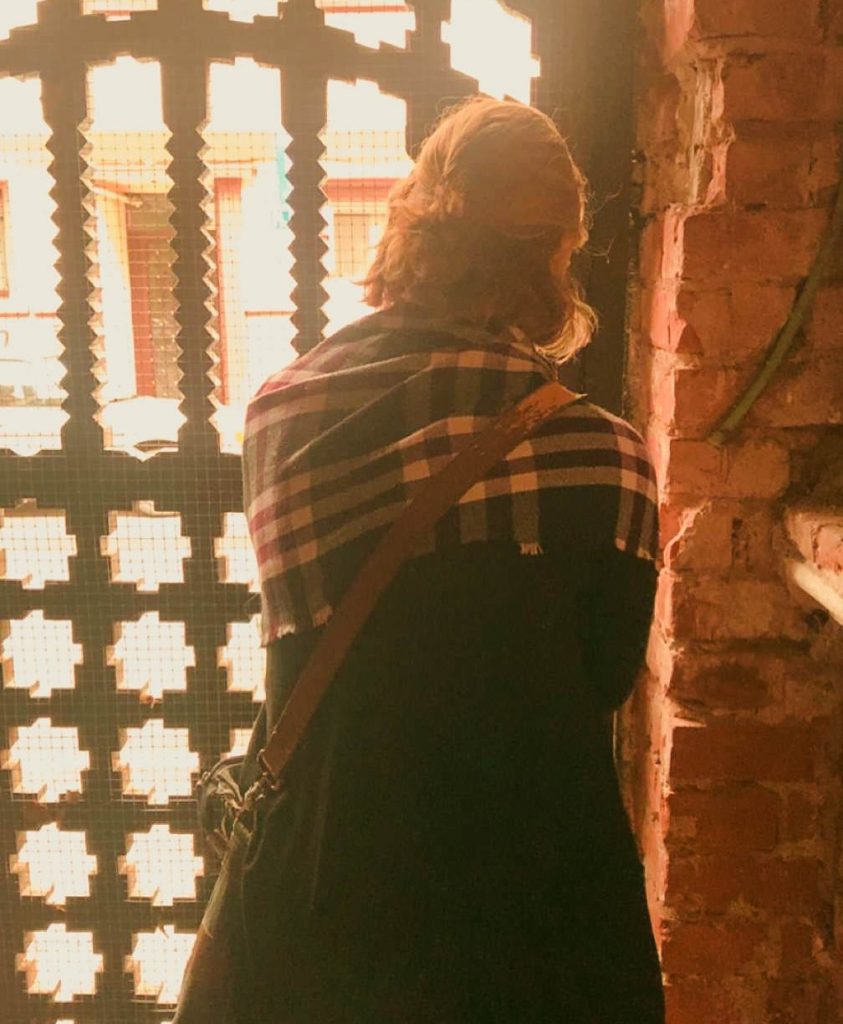 Woman Standing at Gate