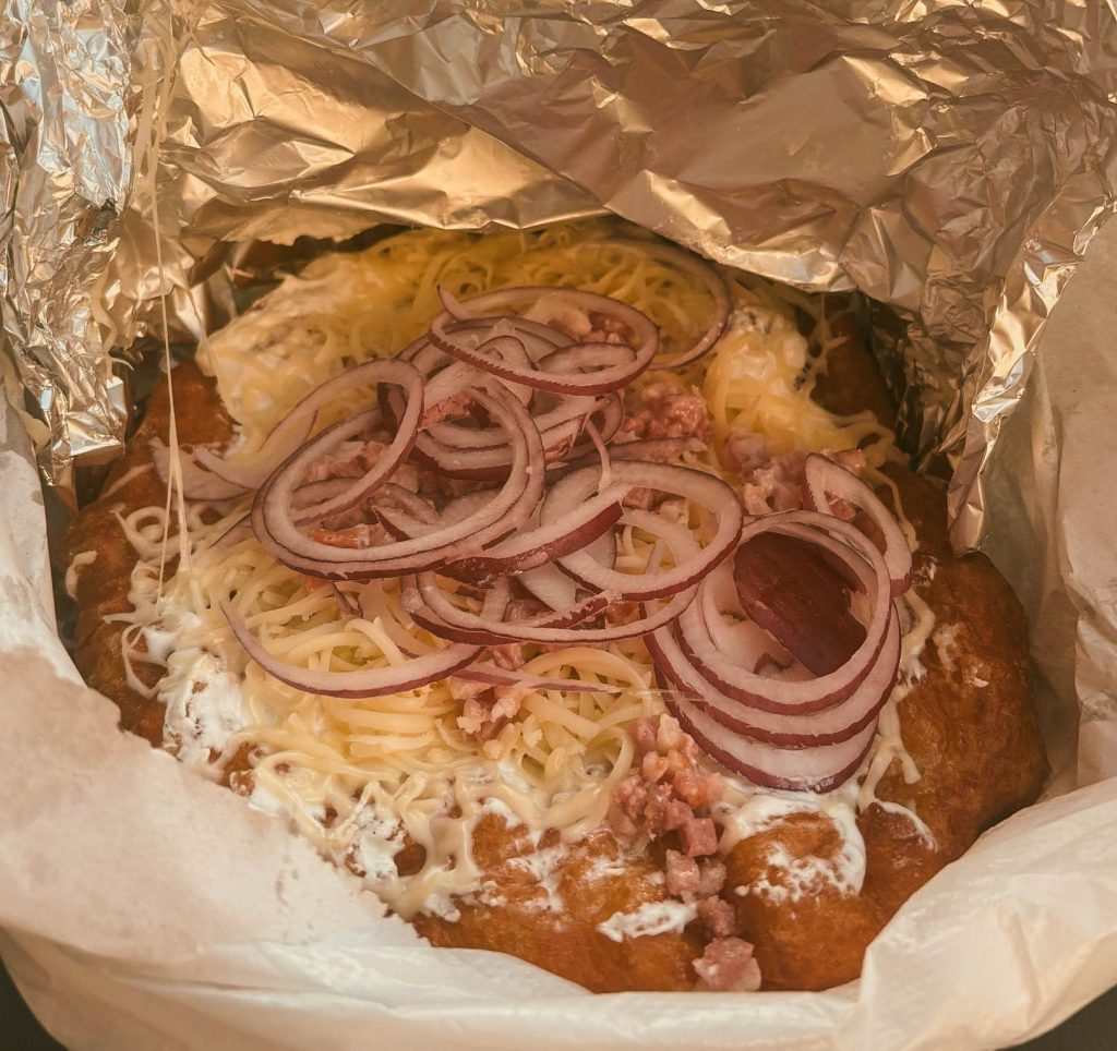 Weekend in Budapest - Itinerary and Guide Langos with cheese onions and bacon