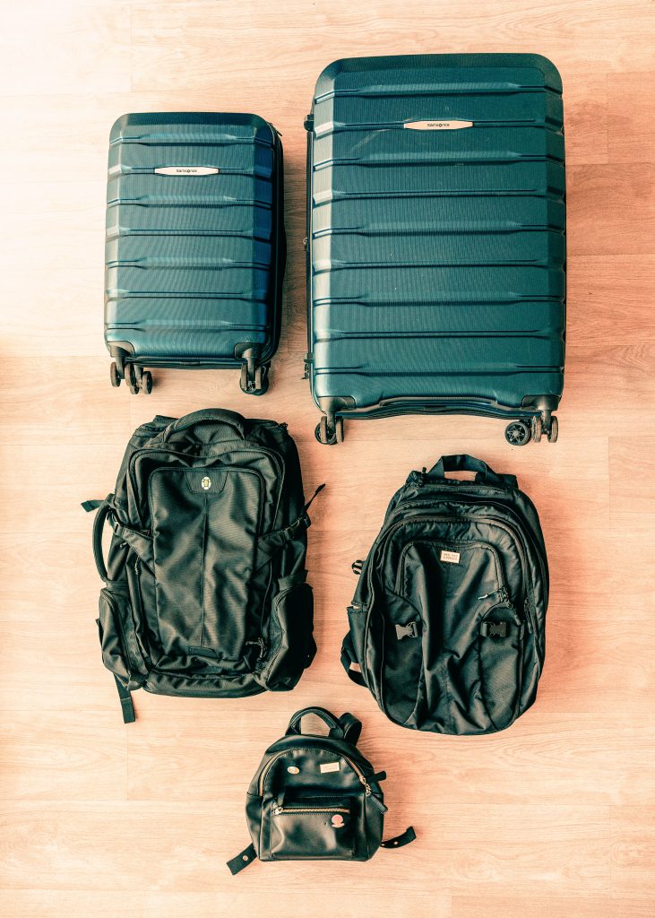 luggage pieces laid out on the floor