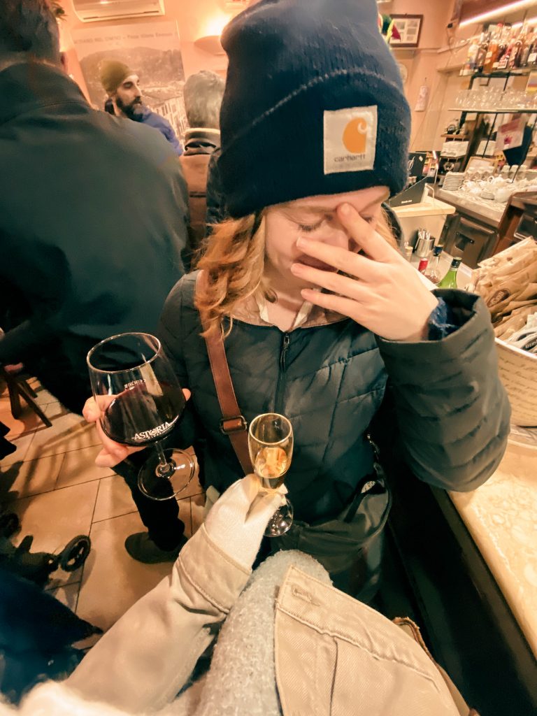 elle in wine shop in italy