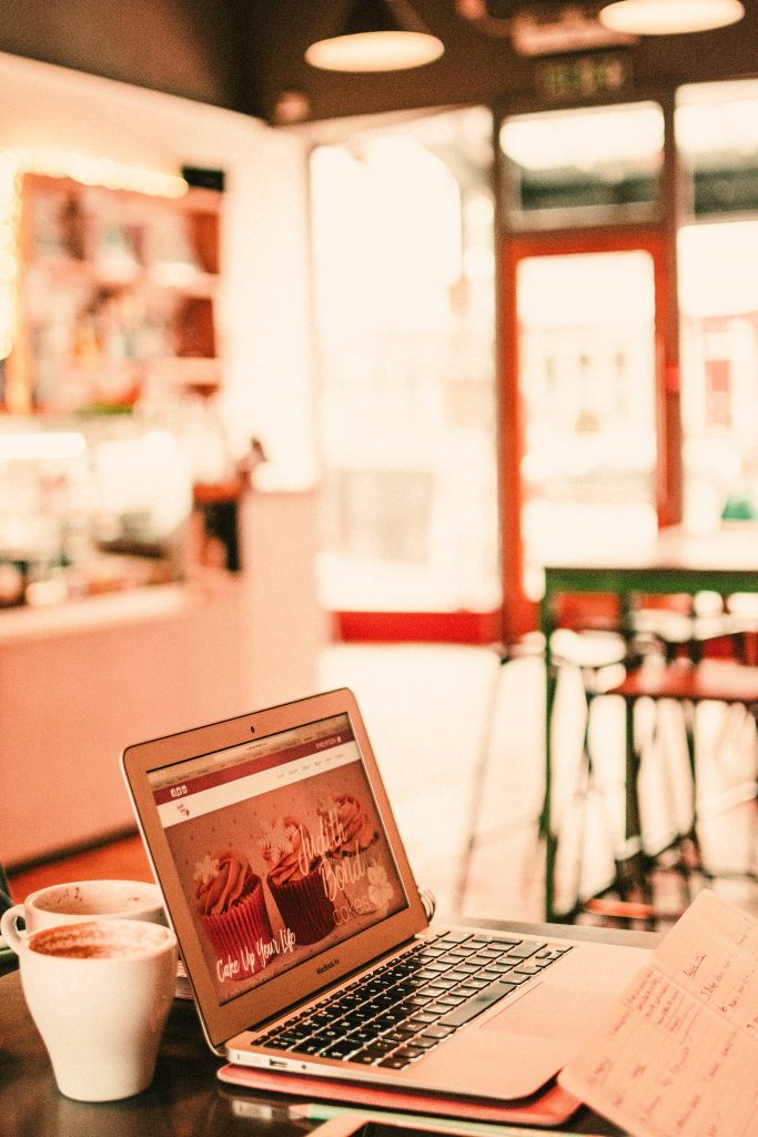 laptop on table at cafe