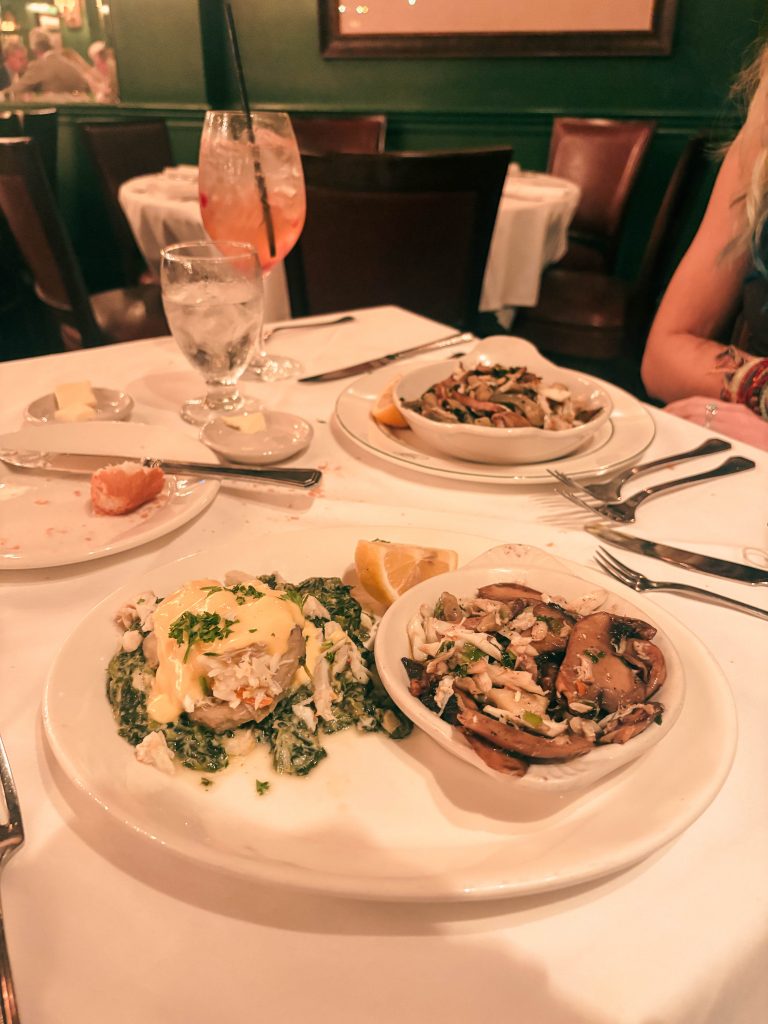 Dining Table with Crab Dishes and Cocktails at Galatoire