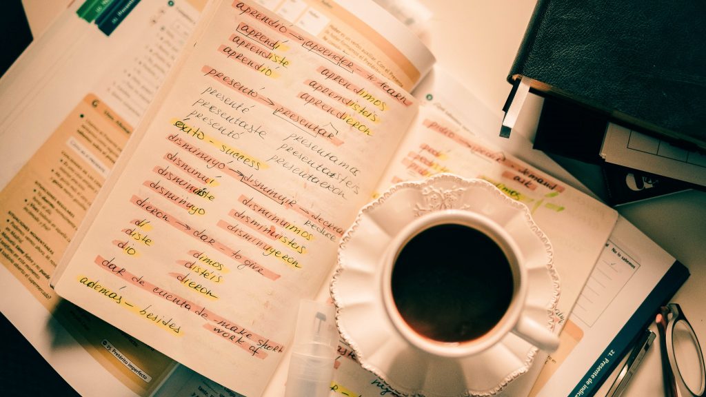 language learning book and coffee