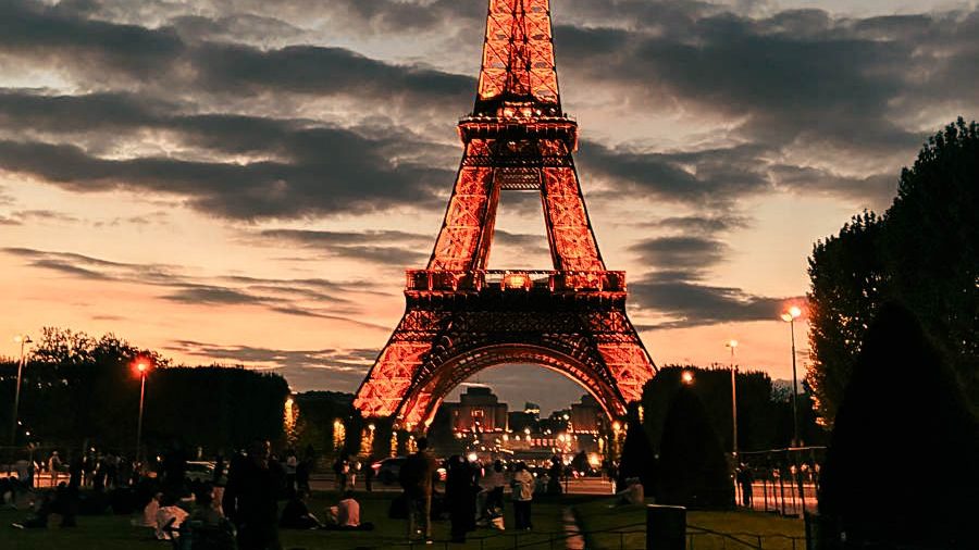 7 Affordable Things to Do Solo in Paris photo of the Eiffel Tower in the evening