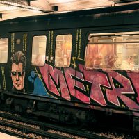 photo of graffiti art on a Paris metro car