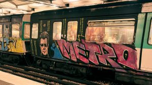 photo of graffiti art on a Paris metro car