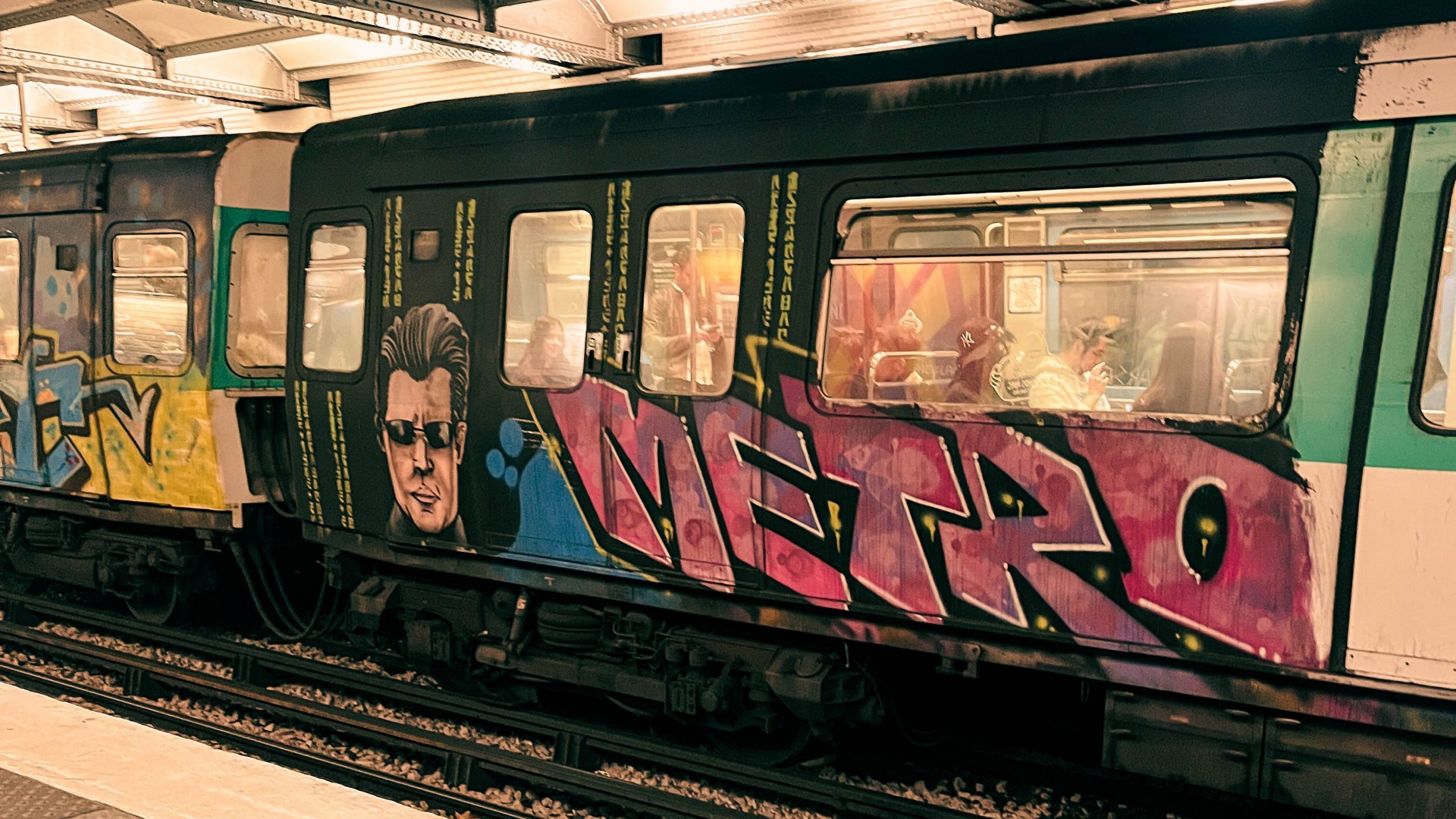 7 Affordable Things to Do Solo in Paris photo of graffiti art on a Paris metro car